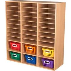 a wooden storage unit with six bins and four different colored baskets on each shelf