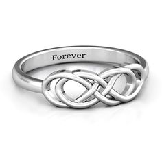 a white gold ring with an intertwined design