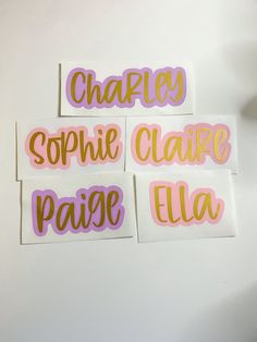 three stickers that say happily, sophiie claire, paise, and ella