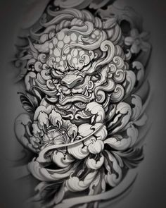 an intricate tattoo design on the back of a woman's arm