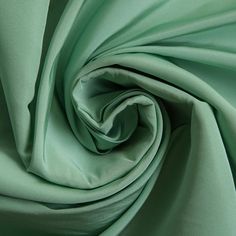 a close up view of a green fabric