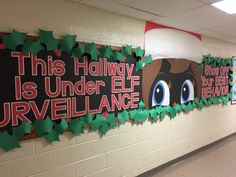 this hallway is decorated with christmas decorations and holiday themed signs for the students to decorate