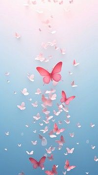 pink butterflies flying in the air above water