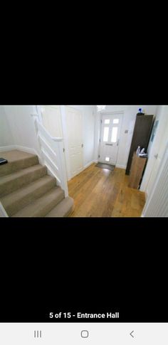 the stairs in this house are white and wood