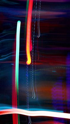 blurry photograph of multicolored lines in motion