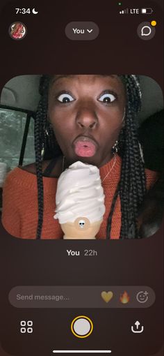 the woman is taking a selfie with an ice cream cone on her face and looking surprised