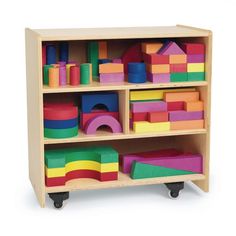 a wooden toy shelf filled with lots of colorful toys