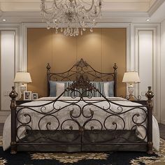 a bedroom with a bed, chandelier and two lamps on either side of the bed