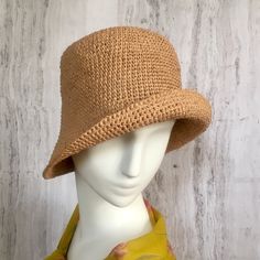 Crochet raffia hat It is a classic accessory for every woman for sun protection, summer parties, beach and travel. Can be a good gift for a woman of any age. The cap is crocheted from natural raffia, light, elastic, the brim of the cap is reinforced with wire. The hat keeps its shape well and does not fade in the sun. The cap is soft to the touch, slightly rough. It is fully crocheted. Easy to carry with foldable design. The hat is perfect for summer wardrobe. Field Size: about 3 inches Care of Handwoven Casual Sun Hat For Summer, Casual Straw Sun Hat With Short Brim, Casual Handwoven Sun Hat For Summer, Casual Woven Brimmed Sun Hat, Warm Weather Paper Straw Hat, Casual Lightweight Crochet Fedora Hat, Casual Crochet Hat With Curved Brim For Warm Weather, Casual Handwoven Panama Hat For Summer, Casual Paper Straw Hat For Warm Weather