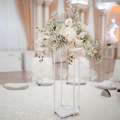 the centerpieces are white flowers and baby's breath