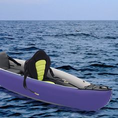 an inflatable kayak floating on the ocean