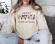 Mickey And Friends Christmas Sweatshirt, Christmas Sweater, Christmas Mickey Sweater, Christmas Party, Holiday Season, Christmas Gift Welcome to our store where you can find beautiful sweaters specially prepared for you. Make yourself and your loved ones happy with these special sweaters. Product details: *Collar, shoulders, armholes, cuffs and bottom hem are double stitched. *1 x 1 rib contains spandex for flexibility. *Collar type: Crewneck *Relaxed fit - Unisex *50% cotton 50% polyester blend Mickey And Friends Christmas, Cute Christmas Sweater, Christmas Mickey, Mickey Mouse Christmas, Friends Christmas, Looking Forward To Seeing You, Sweater Christmas, Friend Christmas, Beautiful Sweater