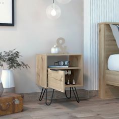 a small wooden cabinet sitting in the corner of a room next to a bed and suitcase