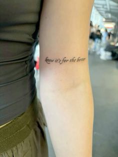 a woman with a tattoo on her arm that says, now it's for the love