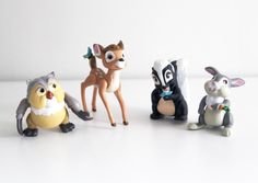 the toy animals are all different colors and sizes