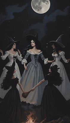 three women dressed as witches in front of a full moon