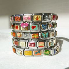 *This listing is for 1 Italian Charm Stretchy Stainless Steel Bracelet. Length is adjustable* Italian Charm Bracelets are back! Straight from the 2000s! Each bracelet is carefully crafted with randomly selected "mystery box" charms. The bracelet will be designed by us, but please leave a note in the "Personalization" Section, so we can better tailor your bracelet to your taste!  Sizing: Each bracelet has 17 charms which is 6.5" -7" in length. Bracelets are stretchy and adjustable in size, but if Adjustable Novelty Charms Bracelets, Vintage Adjustable Beaded Bracelets With Charms, Trendy Customizable Adjustable Charm Bracelet, Trendy Adjustable Customizable Charm Bracelet, Vintage Adjustable Multicolor Charm Bracelet, Adjustable Vintage Multicolor Charm Bracelet, Retro Multicolor Bracelets For Gift, Vintage Multicolor Adjustable Charm Bracelet, Retro Multicolor Bracelets As Gift