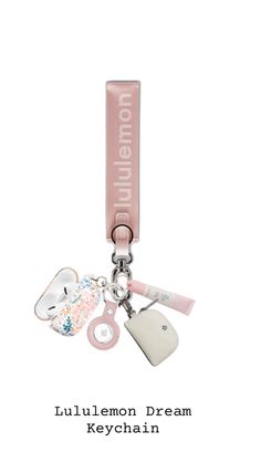 a keychain that has various items attached to it with the words tullemon dream on it