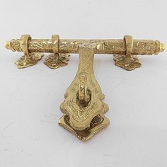 an antique brass door handle on a white background