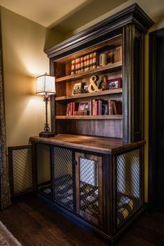 an old fashioned book shelf with books on it