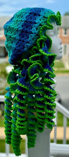 a crocheted hat is on top of a mannequin's head