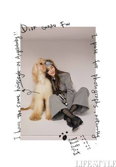 a woman sitting next to a dog with writing on the wall above her and below her