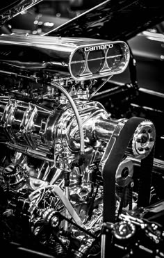 the engine of an old car is shown in black and white