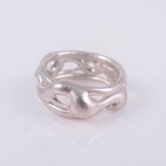 "This band ring has been hand-sculpted in jeweler's wax, then cast in molten sterling silver. Inspired by flowing/tangled vines and roots, it's a smooth design that looks different from every angle; with its open-weave design, there are a lot of twists and turns! The casting process (lost wax casting) means the sculpted wax is destroyed, so each cast piece is one-of-a-kind and cannot be repeated. - Width of band: A little over 1/4\" - Ring size: 5 All of my work is handmade, using recycled materials whenever possible, and incorporating/ re-using gemstones and vintage pieces." Wax Cast Ring, Unique Wedding Jewelry With Lost Wax Casting, Lost Wax Ring, Unique Bangle With Lost Wax Casting, Lost Wax Casting Rings, Nature-inspired Sterling Silver Jewelry With Lost Wax Casting, Cast Rings, Silver Casting, Wax Ring