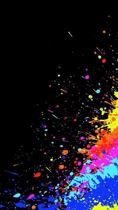 colorful paint splattered on black background with space for your text or image to be added