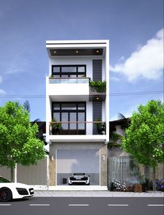 a white car parked in front of a two story building with balconies on the second floor