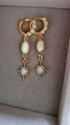 Starburst Opal Earrings  Gold huggie earrings with beautiful shine and a great celestial vibe.  Earrings: ~ 14k Gold Plated ~ With Opal Accents (the opals are synthetic man-made) 👉 Link to Our STOREFRONT: https://www.etsy.com/shop/FashionCrashJewelry?ref=shopsection_shophome_leftnav&ga_search_query=crystal%2Bnecklace Our Motto ~ Happy Customers Are Awesome 🌞Let us know of any problems or concerns with purchases. 🌞 5star reviews and positive comments are greatly appreciated, they help the succ Gold Huggies, Opal Drop Earrings, Halloween Necklace, Positive Comments, Christmas Gift Idea, Huggie Earrings, Opal Earrings, Huggies Earrings, Earrings Gold