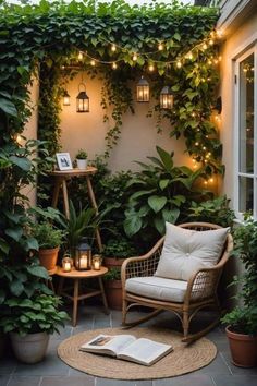 an outdoor patio with potted plants and lights hanging from the ceiling, along with a wicker chair