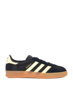 Find ADIDAS ORIGINALS BY ALEXANDER WANG Gazelle Indoor In Black on Editorialist. adidas Originals Gazelle Indoor in Black Suede, leather, and mesh upper with rubber gum sole. Made in Vietnam. Lace-up front. Signature three stripes at side panels. Gold-tone printed Gazelle logo at outer panel. Padded low-cut leather collar with contrast back counter and Adidas logo. ADIO-MZ157. IG4999. About the designer: April Inspiration, Adidas Originals Gazelle, Summer Uniform, Leather Collar, Clean Girl, Side Panels, Adidas Logo, Panel Siding, Alexander Wang