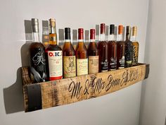 a wooden shelf with bottles of wine on it