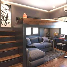 a loft bed with a couch underneath it