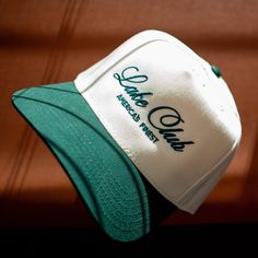 SHIPPING MID MARCH -  It's the summer's favorite club - the Lake Club! Take our design and sport it out on the water for that extra layer of SPF. We love this cursive script and the color matching thread to the bill. The antique white is super crisp! This is the first of this kind of hat, so we can't wait to see how you style it. Tag us on Instagram! @AgencyofSaints Hat Band - 22 ⅘ (adjustable) Crown Height - 4 ¾ Bachelorette Hats, Kinds Of Hats, Custom Trucker Hats, Vintage Trucker Hats, Cursive Script, Casual Outfit Inspiration, Hat Ideas, Old Money Style, Custom Hats