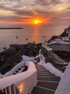 stairs lead down to the water at sunset