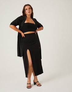 The Curve Double Slit Midi Skirt is a simple wardrobe piece you'll find yourself reaching for again and again. This statement plus size skirt is simple enough to pair with everything but trendy enough with the double slits to be a statement piece in any outfit. Pair it with a flowy blouse for a sultry nighttime outfit. This dress features an elastic waist, double slits at the bottom, and no pockets. The material is a stretchy knit. This skirt is made from 95% rayon and 5% spandex. Hand wash cold Nighttime Outfits, Plus Size Skirt, Simple Wardrobe, Flowy Blouse, Black Midi Skirt, Plus Size Skirts, Again And Again, Find Yourself, The Double