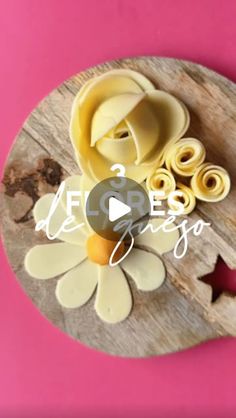 the video shows how to make flower shaped pasta on a wooden board with scissors and cutters