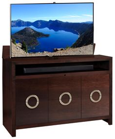 a flat screen tv sitting on top of a wooden entertainment center with metal knobs