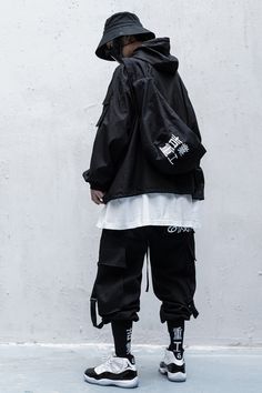 Blend into the cityscape: discover the ideal Techwear Pants for unassuming elegance and stealthy escapes. Introducing the Ninja Pants, an exquisite mix of traditional ninja attire and contemporary Japanese streetwear that encapsulates the essence of urban sophistication. These baggy cargo pants are an essential addition to the wardrobe of any urban dweller seeking a unique and versatile piece of clothing. Whether you are passionate about martial arts or simply appreciate the fusion of tradition Streetwear Fashion Black, Urban Warrior, Ninja Pants, Ninja Outfit, Apocalyptic Clothing, Techwear Pants, Urban Sophistication, Baggy Cargo Pants, Black Cargo Pants