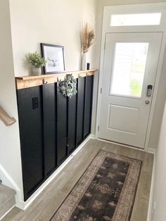 an entryway with a rug on the floor