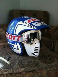 a helmet and goggles sitting on top of a couch