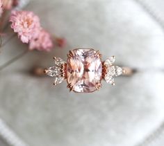 If delicate and feminine is your style but you’re also a strong, independent woman, you can’t go wrong with our Aretha ring with an oh-so-lovely peach sapphire and marquise diamonds. A ring like that makes every woman feel like a natural woman. Details Main stone Gemstone: genuine Ceylon peach sapphire Cut: cushion Wei Blush Engagement Ring, Engagement Ring Rose, Pink Stone Engagement Ring, Sapphire Engagement Ring Pink, Pink Engagement Ring Vintage, Pink Diamond Engagement Ring Vintage, Peach Sapphire Engagement Ring Rose Gold, Pink Sapphire Engagement Ring Rose Gold, Pink Sapphire Engagement Rings