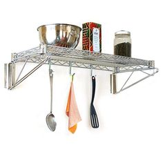 a kitchen shelf with pots and pans hanging from it