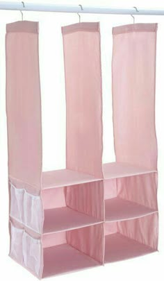 pink hanging closet organizer with four bins