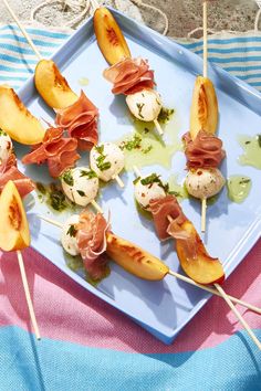 several appetizers are arranged on a blue plate