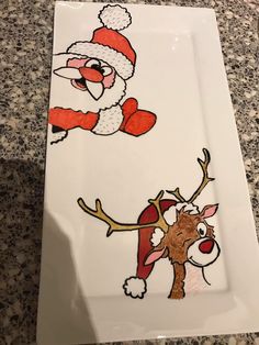 a white plate with santa claus and reindeer on it