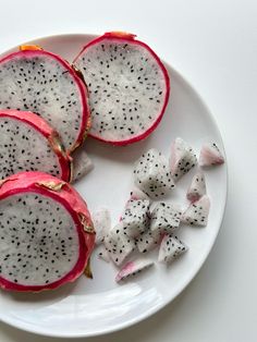 a white plate topped with cut up pieces of fruit