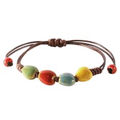 PRICES MAY VARY. VIBRANT HANDCRAFTED CERAMIC BEADS: Each bead on this bohemian bracelet is crafted from ceramic and uniquely colored, offering a vibrant spectrum from earthy greens to sunny yellows, making it a standout accessory. ADJUSTABLE LEATHER CORD: The robust leather cord is designed for longevity and comfort, featuring an adjustable knot that allows for a customized fit for any wrist size. PERFECT FOR LAYERING OR SOLO WEAR: Whether worn alone for a subtle hint of color or layered with ot Ceramic Bead Jewelry, Earthy Greens, Hippie Summer, Boho Style Bracelets, Leather Cord Bracelets, Adjustable Knot, Bohemian Bracelet, Bohemian Bracelets, Craft Corner